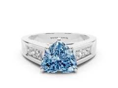 Fancy Blue Heart Cut Diamond Solitaire Ring Set in Platinum with Channel-Set Accent Stones and Prong Setting