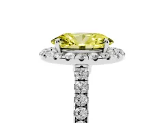 Fancy Yellow Oval Cut Diamond Halo Pavé Engagement Ring Set in White gold with Prong Setting