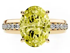 Fancy Yellow Oval Cut Diamond Solitaire Ring Set in Yellow gold with Channel Set Band and Prong Setting