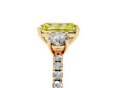 Fancy Yellow Emerald Cut Diamond Three-Stone Ring Set in Yellow gold with Pavé Band and Graduated Sides