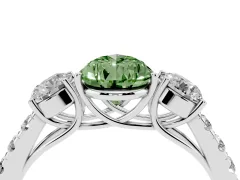 Fancy Green Pear Cut Diamond Three-Stone Ring Set in Platinum with Round Side Stones and Delicate Pavé Band