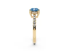 Fancy Blue Cushion Cut Diamond Solitaire Engagement Ring Set in Yellow gold with Pavé Band and Prong Setting