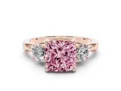 Fancy Pink Cushion Cut Diamond Three-Stone Ring Set in Rose gold with Pavé Band and Smaller Side Stones