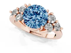 Fancy Blue Round Cut Diamond Solitaire Ring Set in Rose gold with Cluster Accents on Each Side