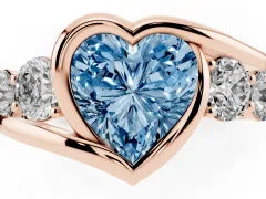 Fancy Blue Heart Cut Diamond Bezel Bypass Ring Set in Rose gold with Round Accents