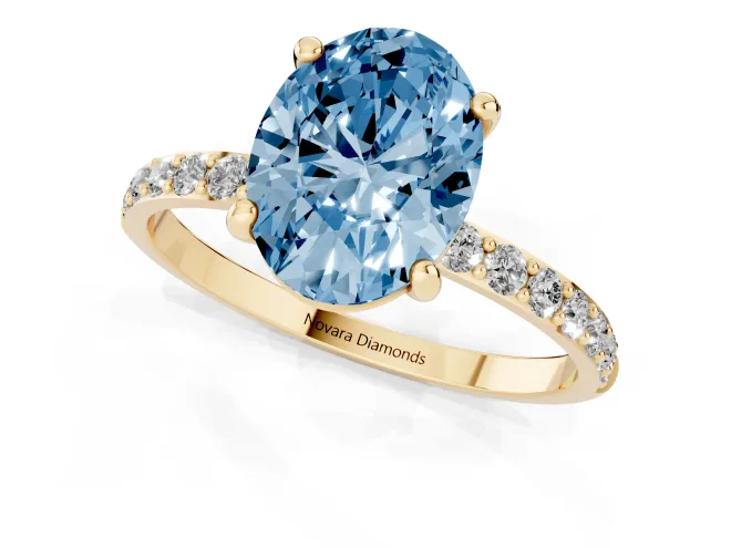 Fancy Blue Oval Cut Diamond Solitaire Ring Set in Yellow gold with Round Pavé Band and Prong Setting – second view