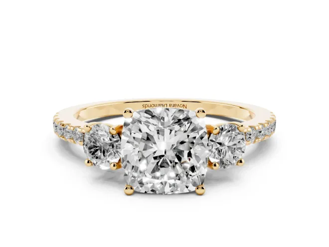 Cushion Cut Diamond Three-Stone Ring Set in Yellow gold with Pavé Band and Graduated Sides