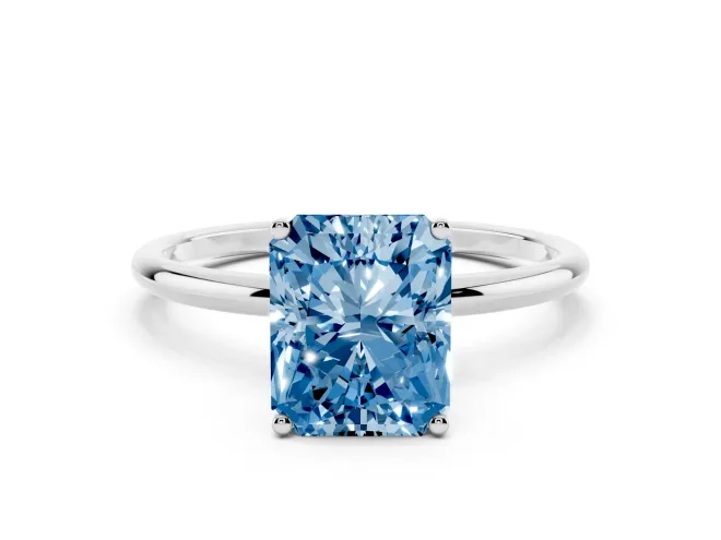 Fancy Blue Radiant Cut Diamond Solitaire Engagement Ring Set in Platinum with Thin Band and Prong Setting