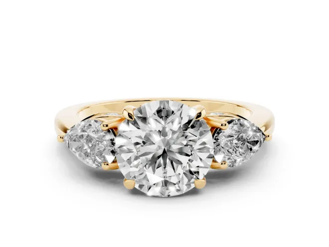Round Cut Diamond Three-Stone Ring Set in Yellow gold with Pear Side Stones