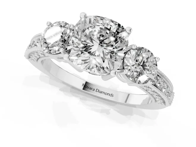 Cushion Cut Diamond Three-Stone Ring Set in Platinum with Round Side Stones and Pavé Band – second view