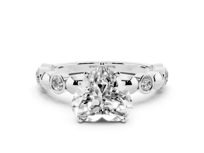 Heart Cut Diamond Solitaire Ring Set in Silver with Bezel-Set Accents on Beaded Band and Prong Setting
