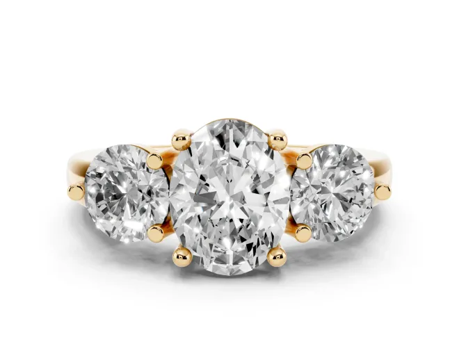 Oval Cut Diamond Three-Stone Ring Set in Yellow gold with Prong Setting and Classic Band
