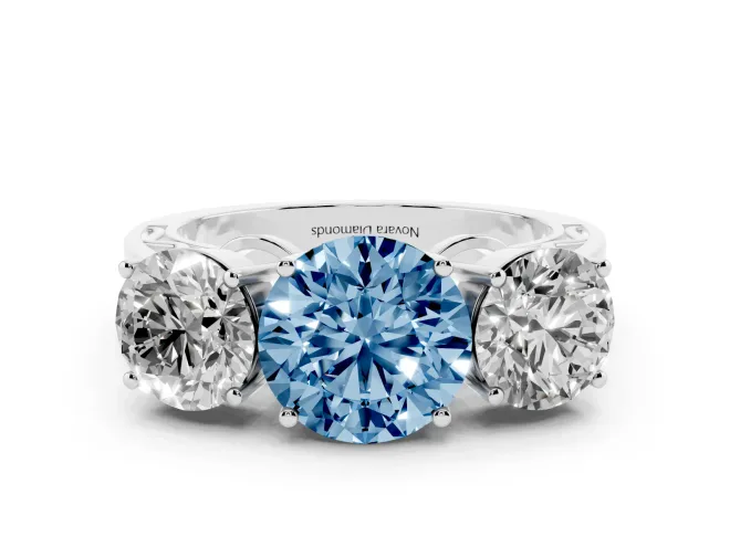 Fancy Blue Round Cut Diamond Three-Stone Ring Set in White gold with Textured Band