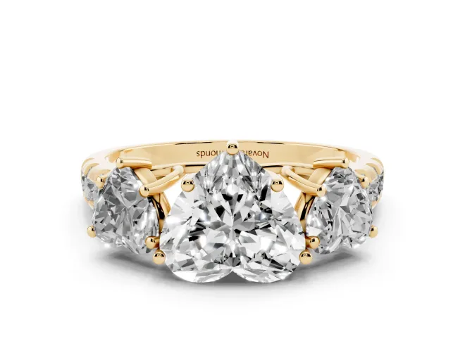 Heart Cut Diamond Three-Stone Ring Set in Yellow gold with Pavé Band