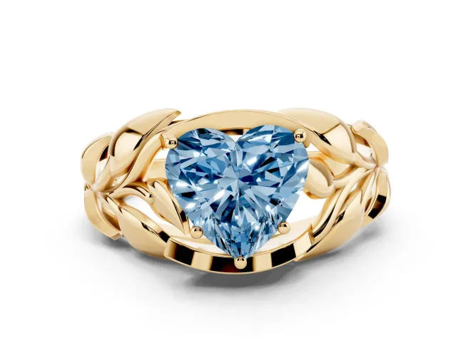 Fancy Blue Heart Cut Diamond Leaf-Inspired Engagement Ring Set in Yellow gold with Round Accents