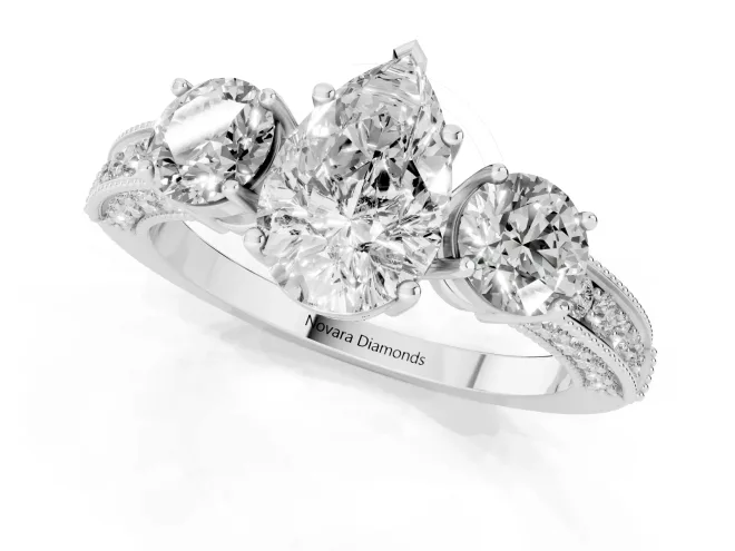 Pear Cut Diamond Three-Stone Ring Set in White gold with Round Side Stones and Pavé Band – second view