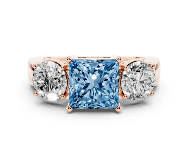 Fancy Blue Princess Cut Diamond Three-Stone Ring Set in Rose gold with Round Side Stones and Classic Band