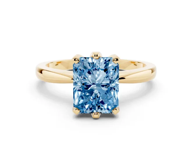 Fancy Blue Radiant Cut Diamond Solitaire Engagement Ring Set in Yellow gold with Slim Tapered Solitaire Band