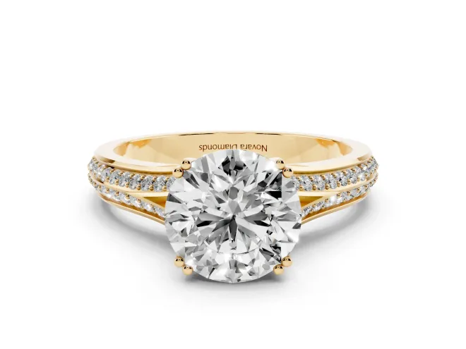 Round Cut Diamond Split Shank Pavé Engagement Ring Set in Yellow gold with Prong-Set Center Stone