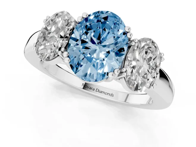 Fancy Blue Oval Cut Diamond Three-Stone Ring Set in White gold with Polished Band and Prong Setting – second view