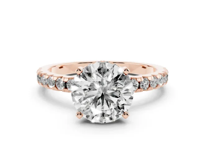 Round Cut Diamond Pavé Solitaire Ring Set in Rose gold with Round Band Accents and Prong Setting