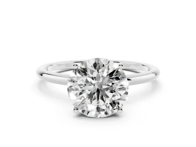 Round Cut Diamond Solitaire Engagement Ring Set in White gold with Thin Band and Prong Setting