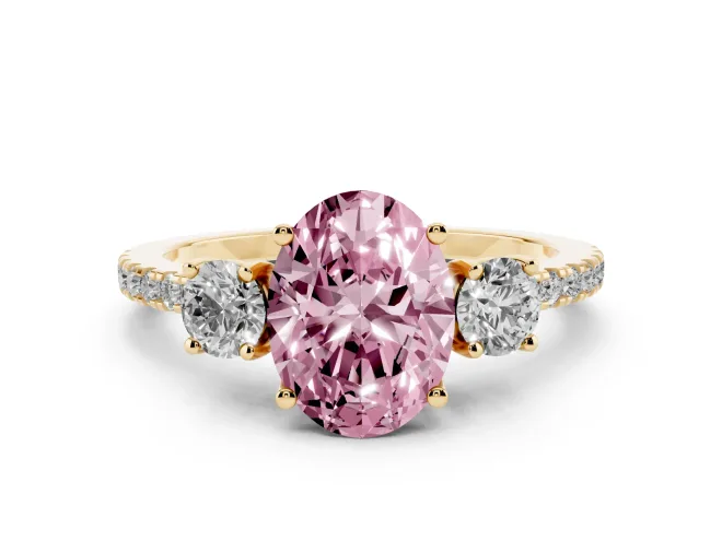 Fancy Pink Oval Cut Diamond Three-Stone Ring Set in Yellow gold with Pavé Band and Graduated Sides