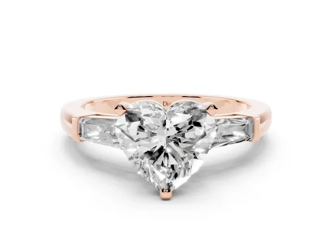 Heart Cut Diamond Solitaire Ring Set in Rose gold with Tapered Baguette Side Stones and Prong Setting