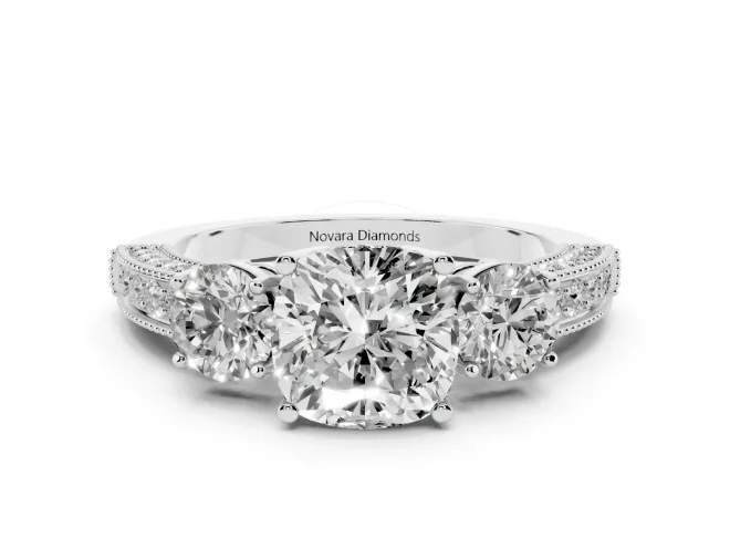 Cushion Cut Diamond Three-Stone Ring Set in White gold with Round Side Stones and Pavé Band
