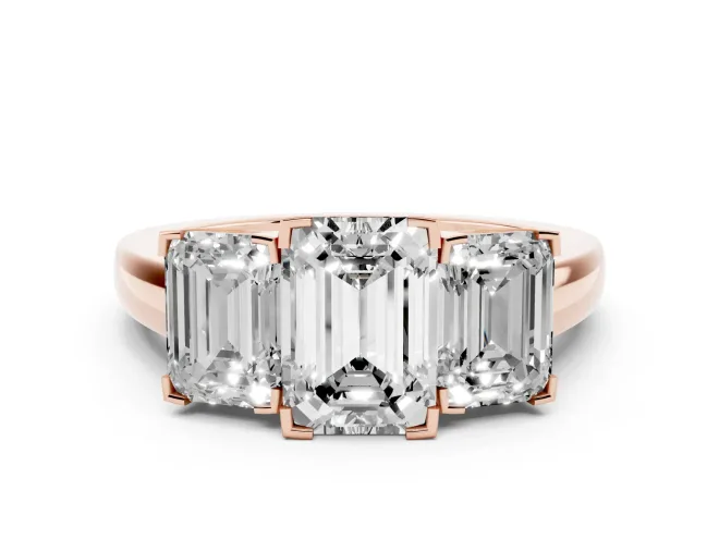 Emerald Cut Diamond Three-Stone Ring Set in Rose gold with Channel-Set Band and Prong Settings