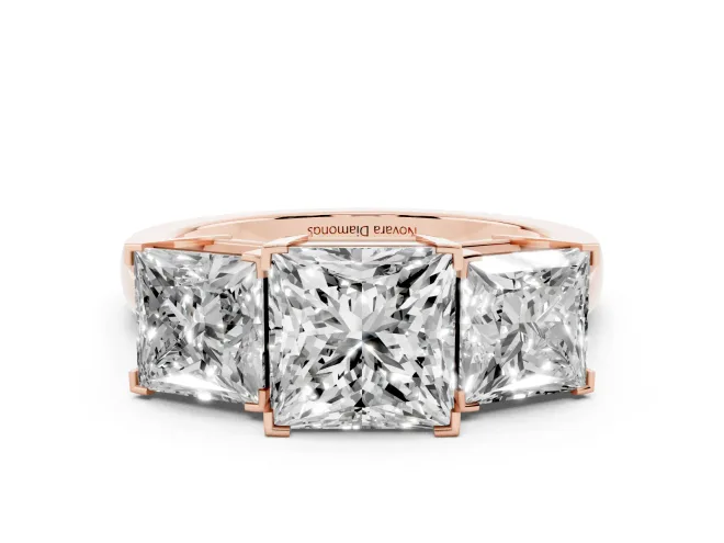 Princess Cut Diamond Three-Stone Ring Set in Rose gold with Channel-Set Band and Prong Settings