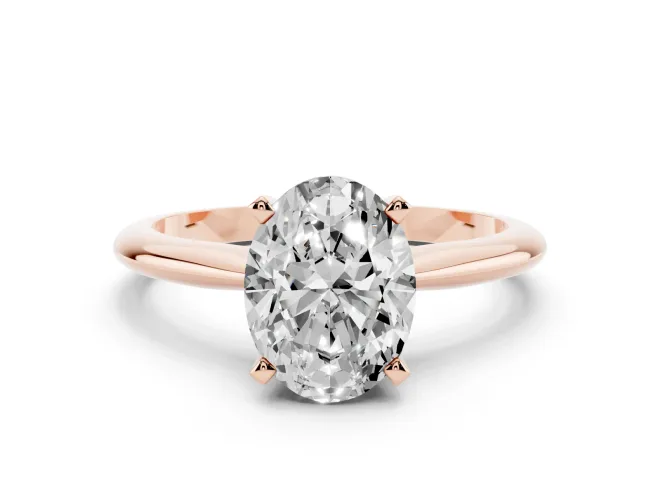 Oval Cut Diamond Solitaire Ring Set in Rose gold with Prong Setting on a Plain Round Band