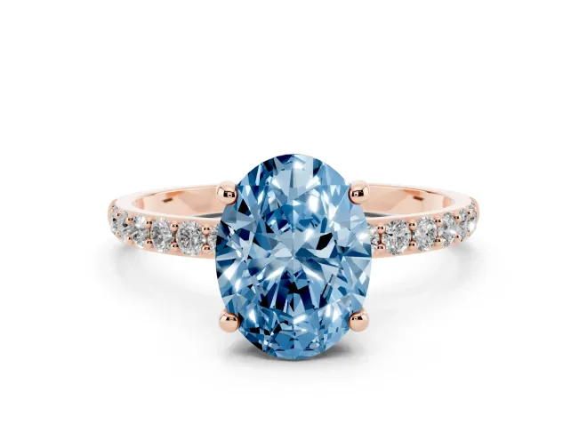 Fancy Blue Oval Cut Diamond Solitaire Ring Set in Rose gold with Round Pavé Band and Prong Setting