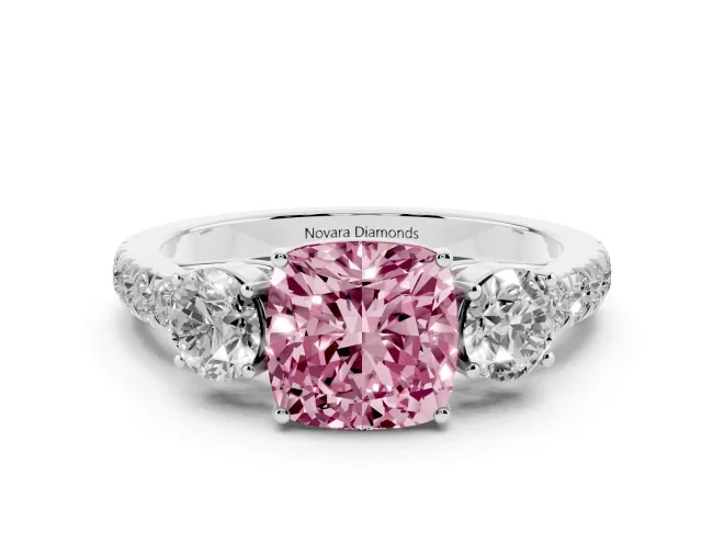 Fancy Pink Cushion Cut Diamond Three-Stone Ring Set in Platinum with Round Side Stones and Delicate Pavé Band
