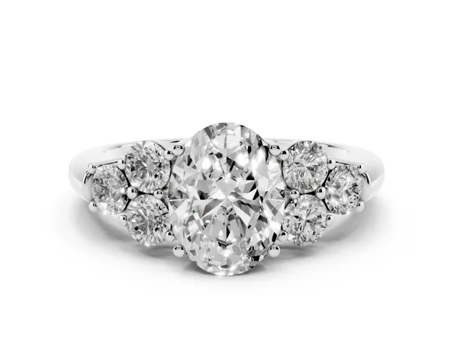 Oval Cut Diamond Cluster Ring Set in Silver with Round Accent Stones and Prong Setting on a Plain Band