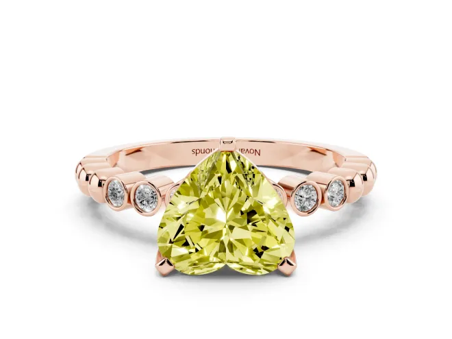 Fancy Yellow Heart Cut Diamond Solitaire Engagement Ring Set in Rose gold with Bezel Accents on Beaded Band