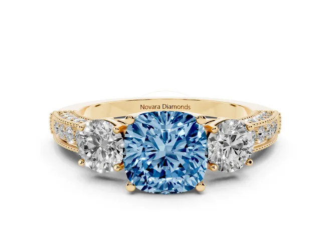 Fancy Blue Cushion Cut Diamond Three-Stone Ring Set in Yellow gold with Round Side Stones and Pavé Band