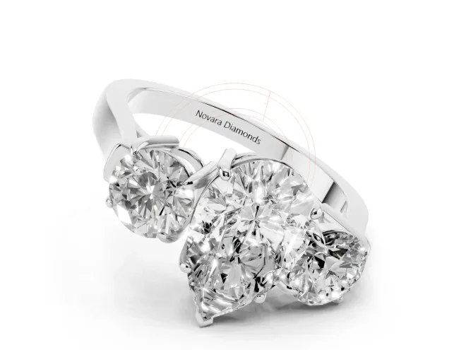 Pear Cut Diamond Three-Stone Ring Set in White gold with Round Accent Stones and Plain Band