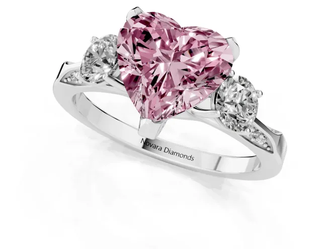 Fancy Pink Heart Cut Diamond Three-Stone Ring Set in White gold with Pavé Band and Smaller Side Stones – second view