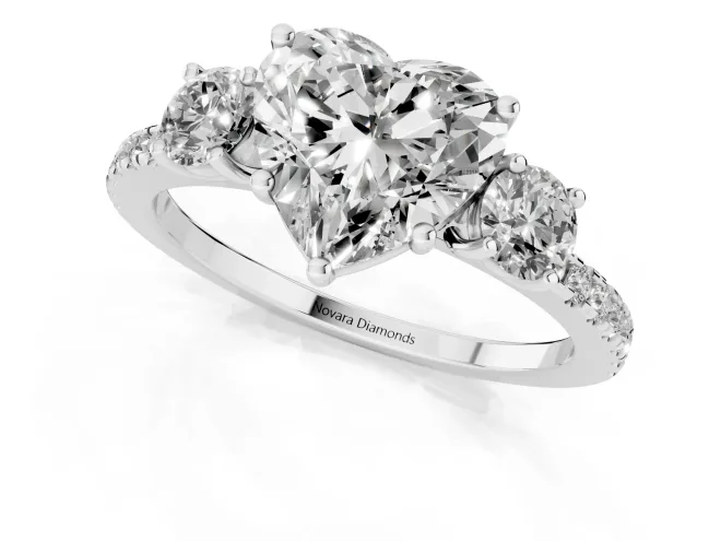 Heart Cut Diamond Three-Stone Ring Set in White gold with Pavé Band and Graduated Sides – second view