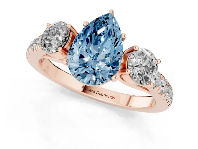 Fancy Blue Pear Cut Diamond Three-Stone Ring Set in Rose gold with Round Side Stones and Delicate Pavé Band – second view