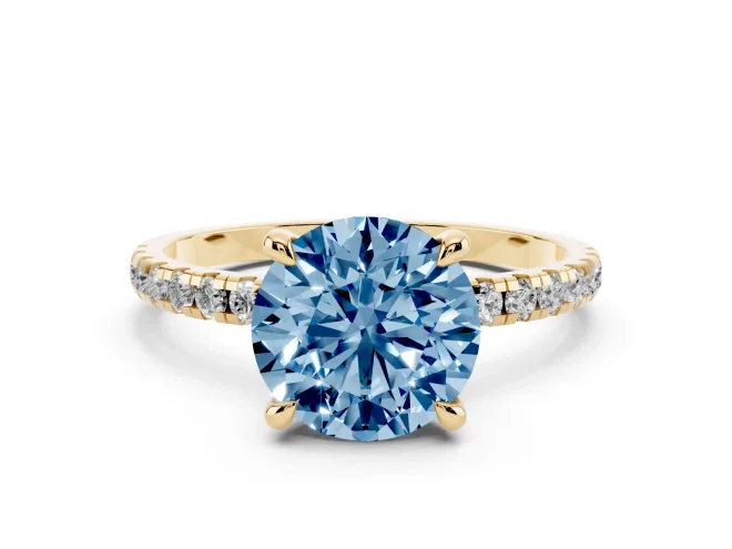 Fancy Blue Round Cut Diamond Brilliant Solitaire Ring Set in Yellow gold with Pavé Band and Prong Setting