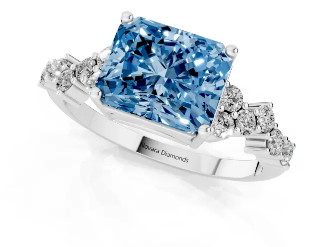 Fancy Blue Radiant Cut Diamond Ring Set in Platinum with Scattered Round Accents – second view