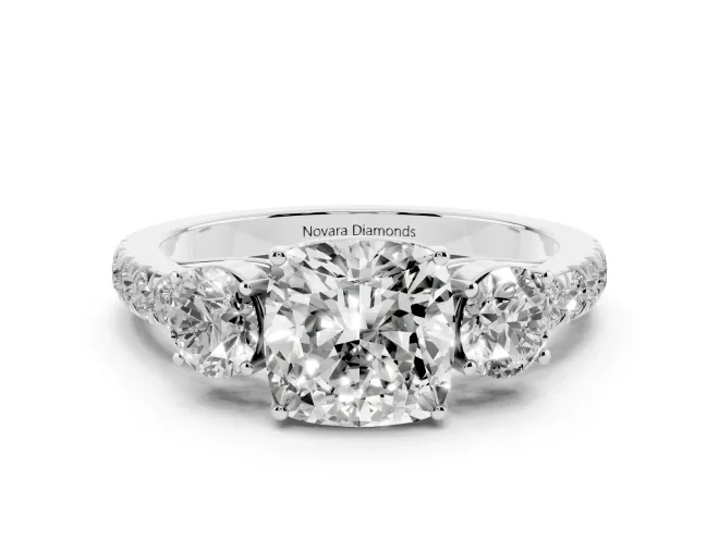 Cushion Cut Diamond Three-Stone Ring Set in White gold with Round Side Stones and Delicate Pavé Band