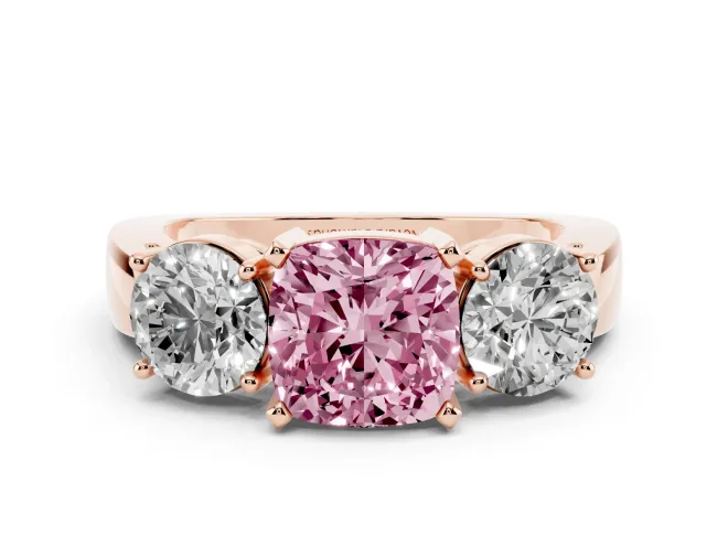 Fancy Pink Cushion Cut Diamond Three-Stone Ring Set in Rose gold with Round Side Stones and Classic Band