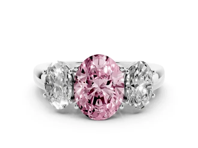 Fancy Pink Oval Cut Diamond Three-Stone Ring Set in Silver with Bold Center and Classic Band