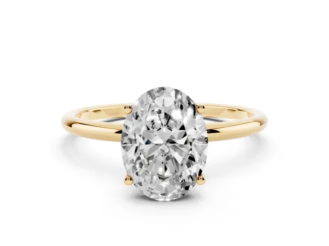 Oval Cut Diamond Solitaire Engagement Ring Set in Yellow gold with Thin Band and Prong Setting
