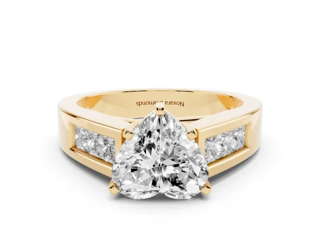Heart Cut Diamond Solitaire Ring Set in Yellow gold with Channel-Set Accent Stones and Prong Setting