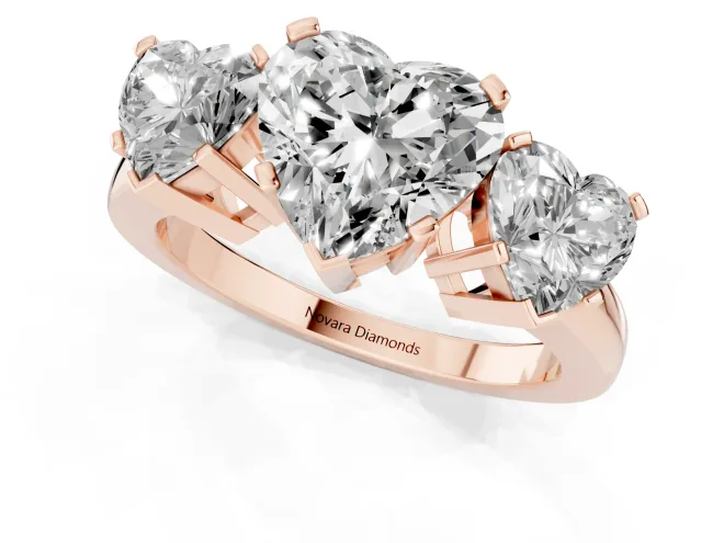 Heart Cut Diamond Three-Stone Ring Set in Rose gold with Channel-Set Band and Prong Settings – second view