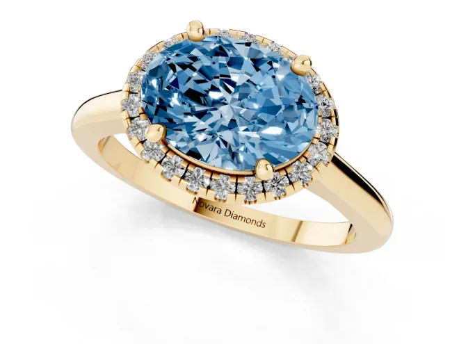 Fancy Blue Oval Cut Diamond Halo Engagement Ring Set in Yellow gold with Pavé Band and Rising Shoulders – second view